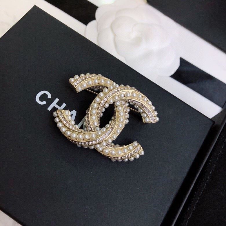 Ch**el brooches